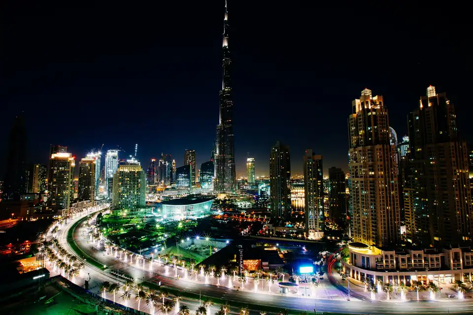 Downtown Dubai at night with the Burj Khalifa and the fountain lake